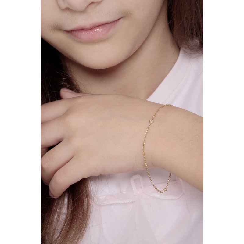 Bracelet fantaisie femme en or jaune 18 carats avec quatre zircons