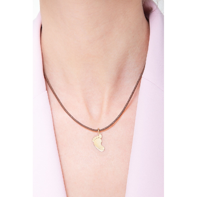 Pendentif en forme de petit pied en or jaune 18k