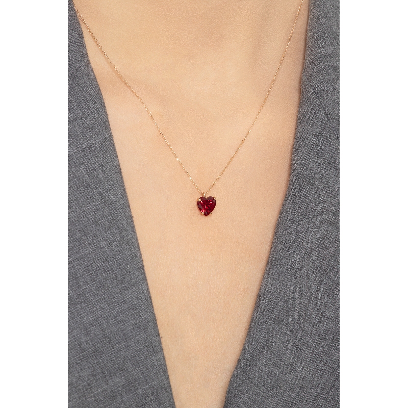 Collier en or rose 18k avec pendentif et zircon rouge