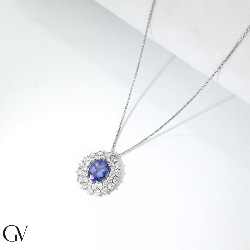  Collier en or blanc 18k avec tanzanite ovale et double halo de diamants
