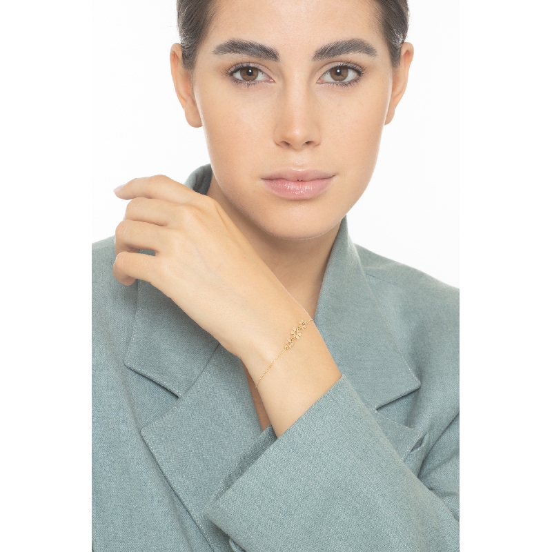 Bracelet en or jaune 18k trois fleurs 