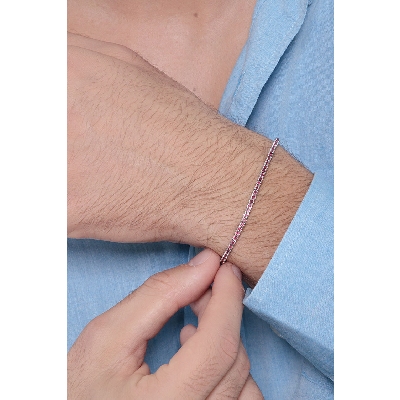 Bracelet tennis a griffes en or blanc 18k serti de rubis femme