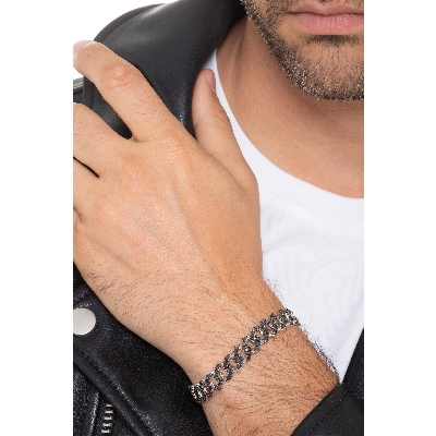 Bracelet groumette en or blanc 18k avec diamants noirs. Pointes brunies.