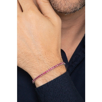 Bracelet tennis griffé en or blanc 18k serti de rubis 