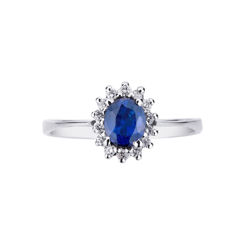 Bague en or blanc avec saphir bleu et halo de diamants