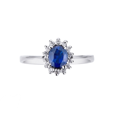 Bague en or blanc avec saphir bleu et halo de diamants