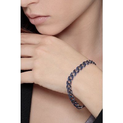 Bracelet gourmette en or blanc 18K avec saphirs bleus