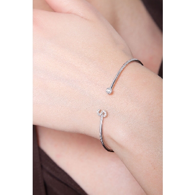 Bracelet rigide avec lettre  S en diamants et or blanc 750