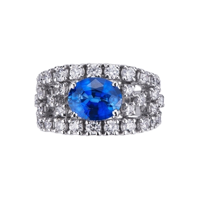 Bague en or blanc 18k avec saphir bleu central