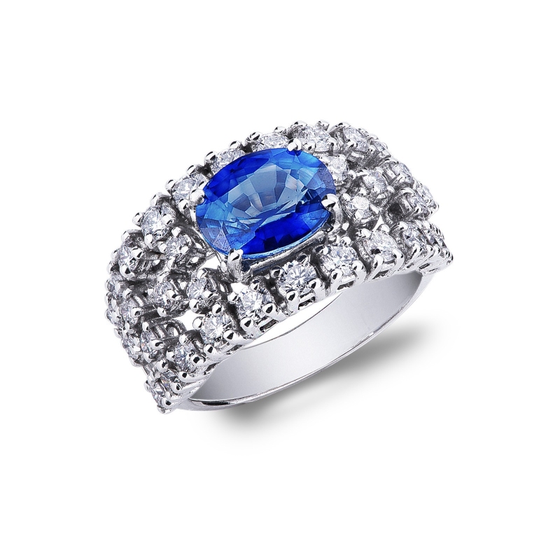 Bague en or blanc 18k avec saphir bleu central