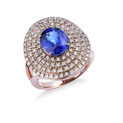 Bague halo en or rose 18k avec des saphirs bleus