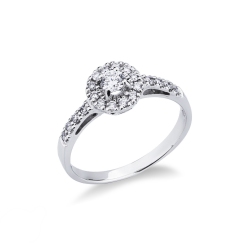 Bague en or blanc 18k avec diamant central et pavé