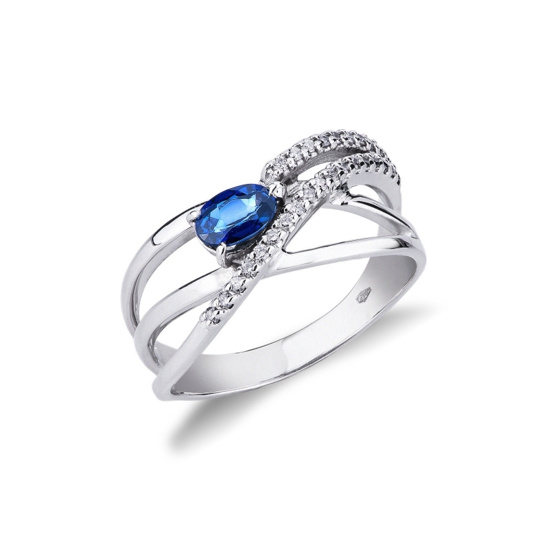 Bague en or blanc 18k sertie de diamants et d’un saphir bleu 