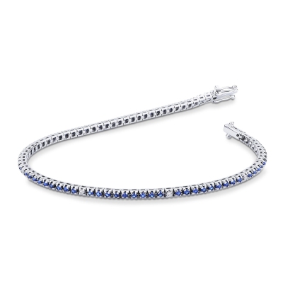 Bracelet tennis griffes en or blanc 18K avec saphirs bleus et diamants