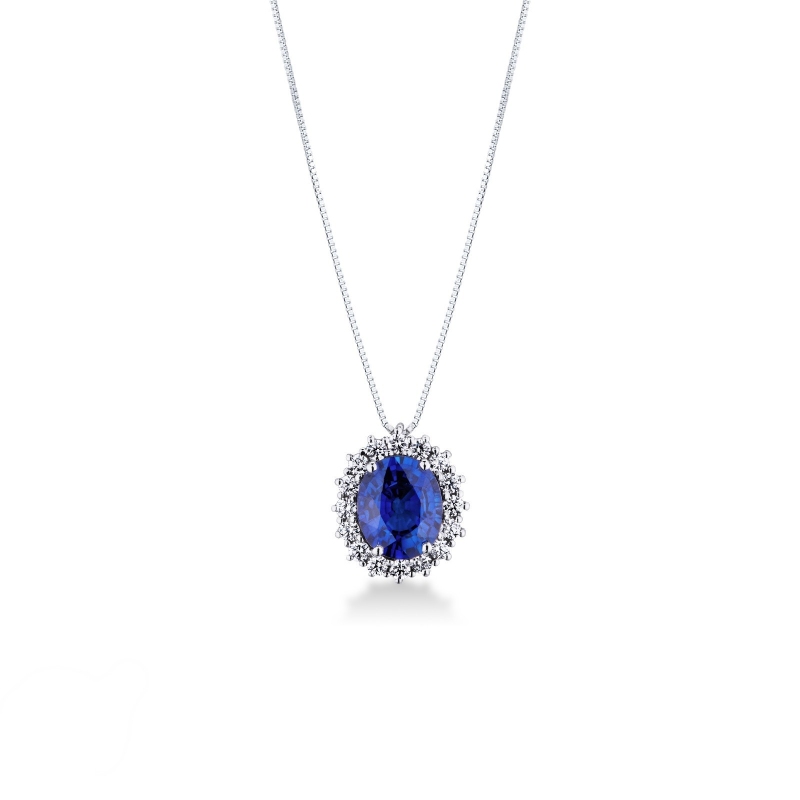 Pendentif en or blanc 18 ct avec saphir bleu taille ovale et halo diamants