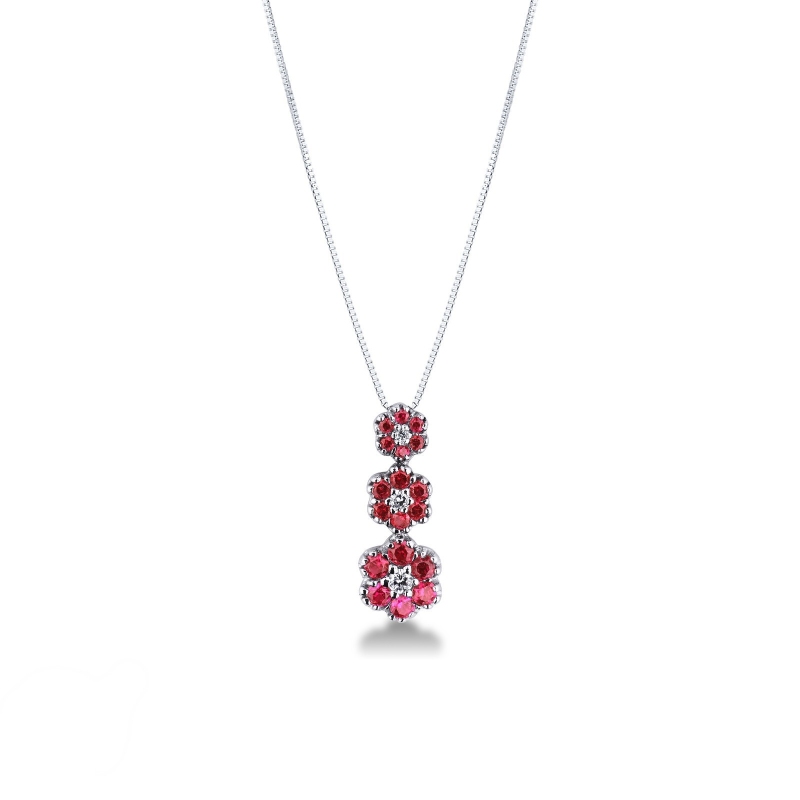 Collier trilogie en or blanc 18k avec trois fleurs avec rubis