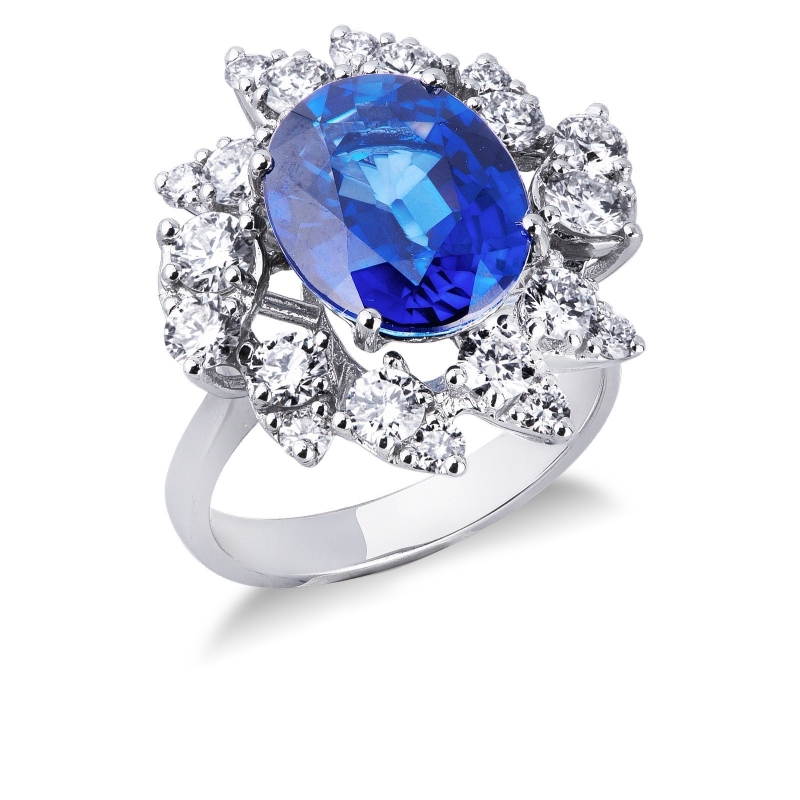 Bague halo en or blanc 18k sertie d’un saphir bleu taille ovale et diamants 