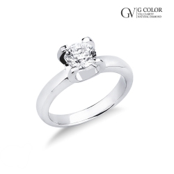 Bague solitaire à 4 griffes en or blanc 18 carats avec diamant 0.90ct
