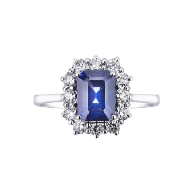 Bague halo en or 18k avec saphir bleu et diamants