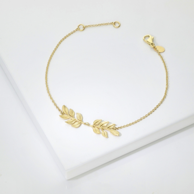 Bracelet en or jaune 18k avec deux feuilles brillantes et satinées