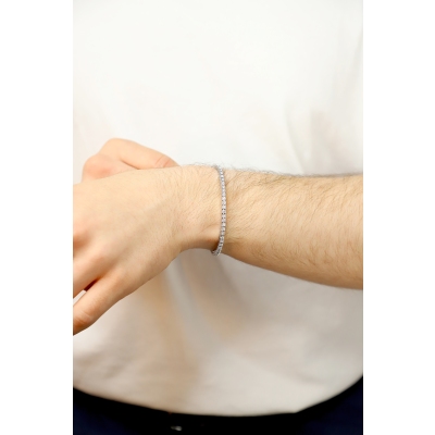 Bracelet tennis griffe elastique en or blanc 750 avec diamants
