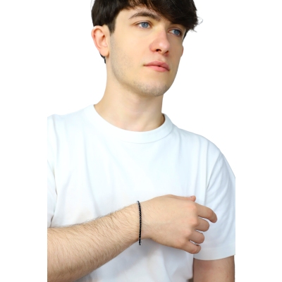 Bracelet tennis élastique griffé avec diamants noirs en or blanc 18k