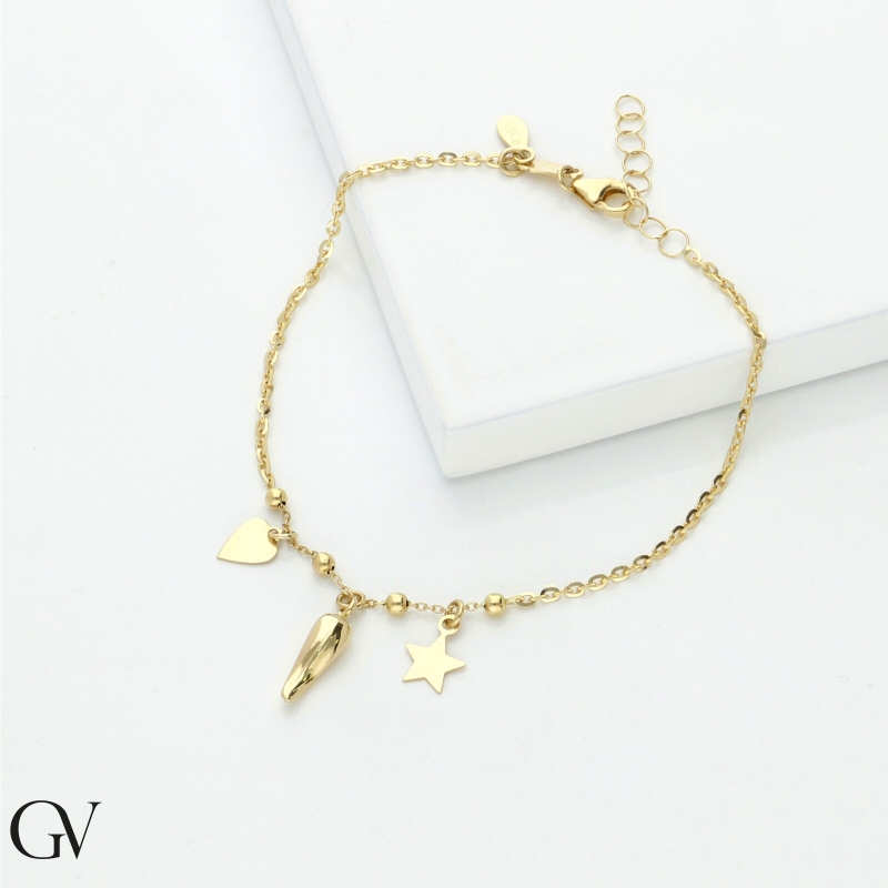 Bracelet en or jaune 18k avec charms porte-bonheur