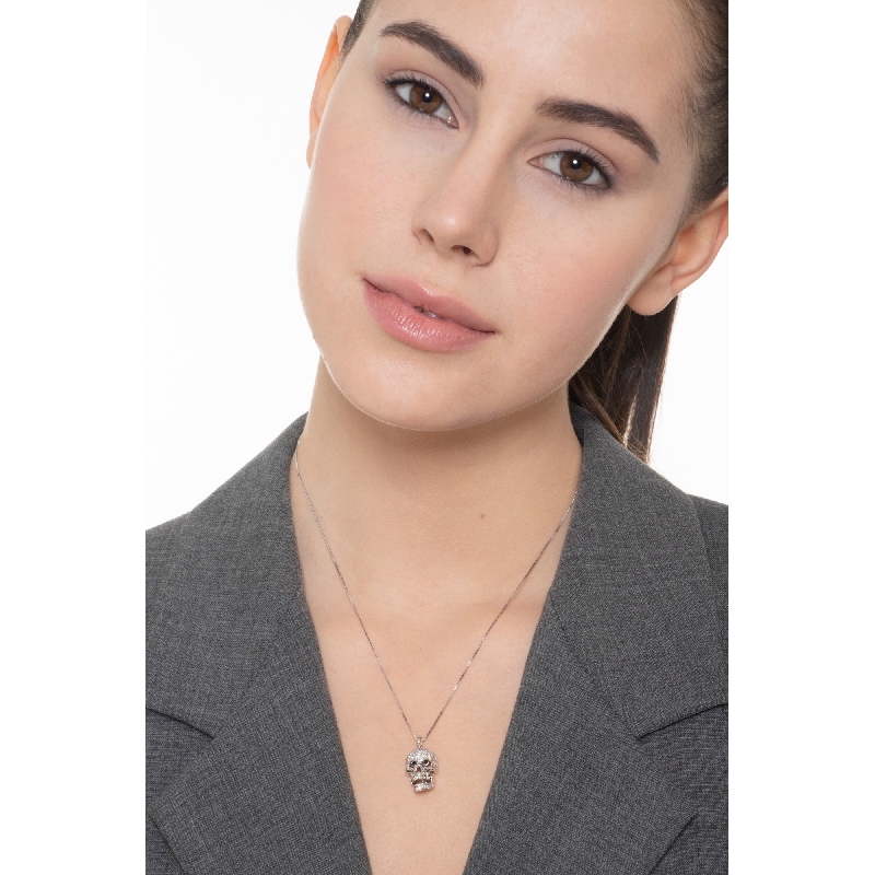 Collier en or blanc 18 carats  tête de mort en diamants blancs et yeux noirs